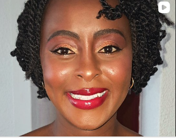 Radiant makeup look with warm golden eyes and a glossy red lip